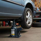 Borum Industrial Hydraulic Squat Bottle Jack - 20 Tonne Capacity being used in an automotive workshop
