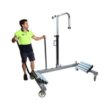 A staff using the Borum Industrial Hydraulic Steel Wheel Dolly - 1200kg Capacity