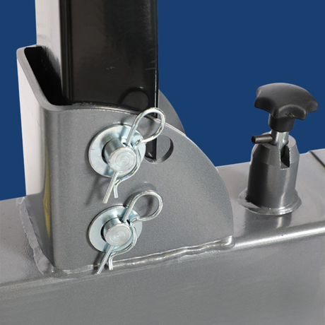 Close-up of a metal bracket with screws on a blue background