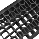 Close-up of a black honeycomb pattern on a white background