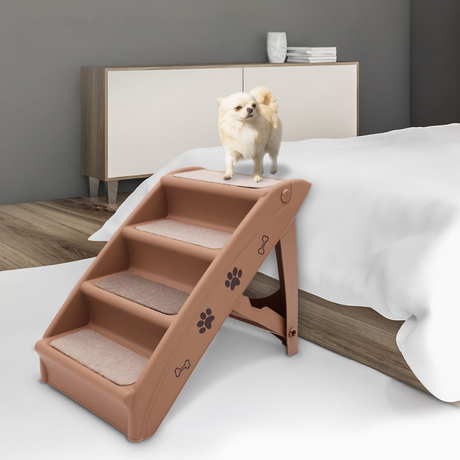 Dog standing on a set of pet stairs in a bedroom setting.