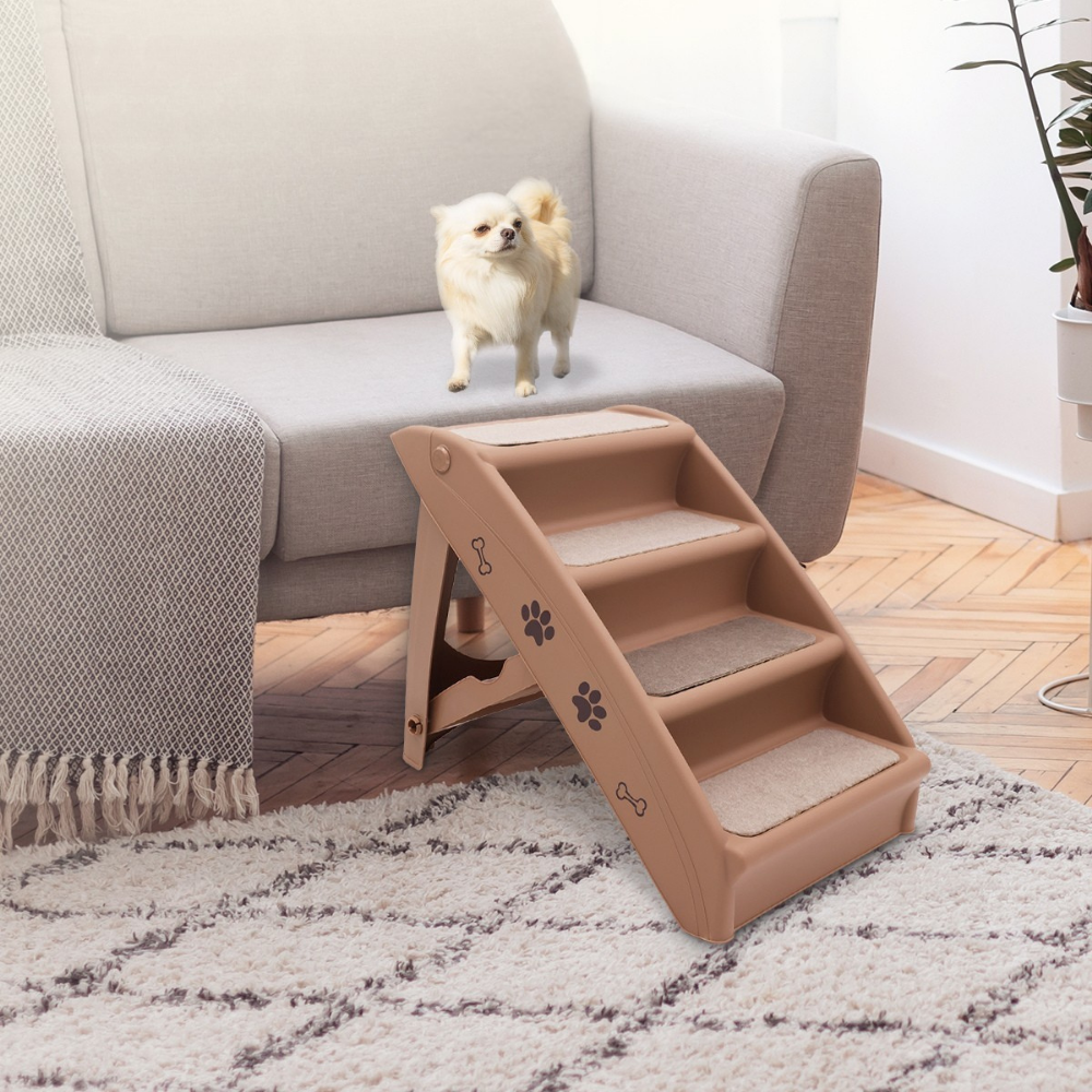 Pet steps leading up to a couch with a small dog standing on the steps