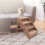 Pet steps leading up to a couch with a small dog standing on the steps