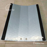 Metal ramp with rubber pads on a tiled floor