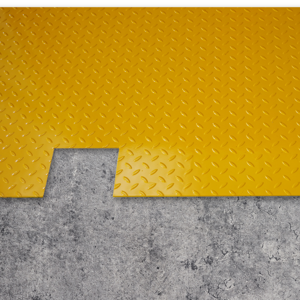 Yellow diamond plate mat on a concrete floor