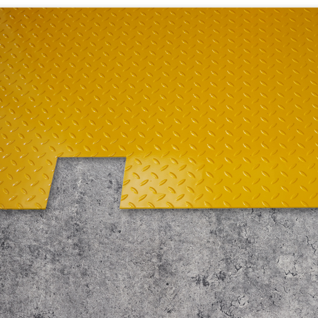 Yellow diamond plate mat on a concrete floor