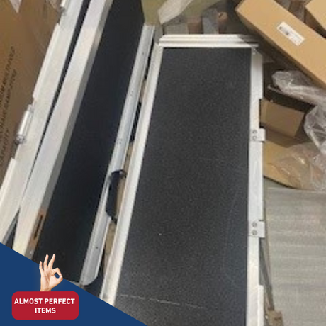 Top view of a folded portable ramp showing black grip surface and aluminium frame edges, marked with 'Almost Perfect Items'.