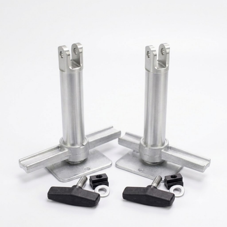 Two silver metal mounting posts with flat base plates, shown with four black wing nuts and small black hardware pieces on a clean white background.