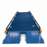A blue metal flatbedyard ramp with diamond-plate textured ramps and side rails, shown on a clean white background.