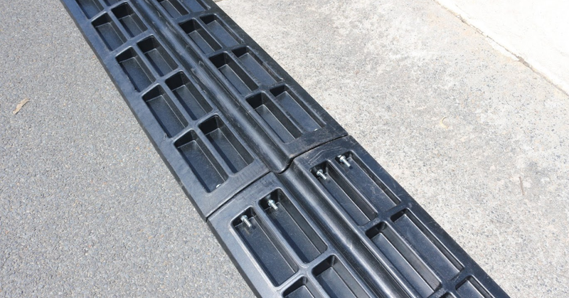 Black rubber ramp on a concrete surface