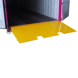 A yellow Heeve self-supporting forklift container ramp placed in front of an open shipping container, showing the forklift tyne slots and the anti-skid surface.
