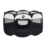 Side profile of the black and white pet playpen showing mesh panels and storage pocket.