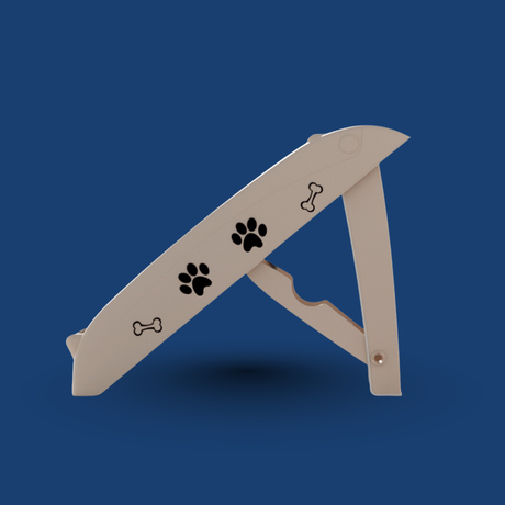 Beige folding dog ramp with paw and bone prints on a blue background