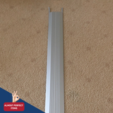 Kilargo 100mm Heavy-Duty Aluminium Threshold Plate 14mm High on a carpet surface with almost perfect logo