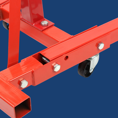 Red metal frame with wheels on a blue background
