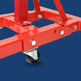 Red metal frame with a wheel on a blue background