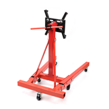 Red hydraulic floor jack on a white background