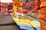 Worker lifting a LowPro road plate with an EasiLift handle