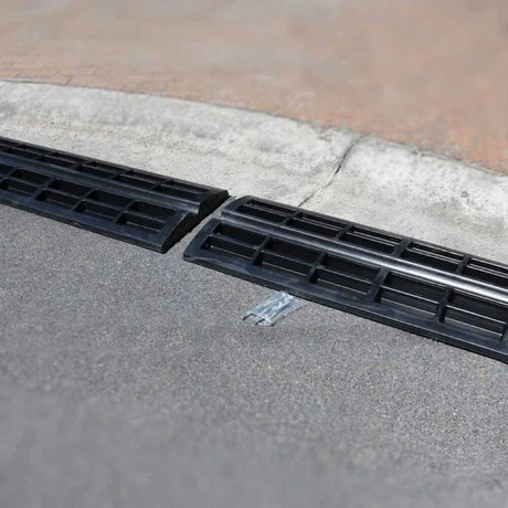 Ramp installed over kerb with black insert section.