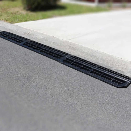 Narrow ramp profile viewed from side at kerb.

