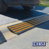 a car running towards the road using the rubber kerb ramp 