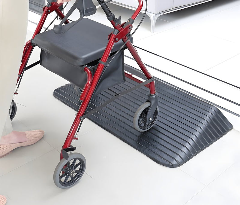 A walker crossing a Heeve rubber threshold ramp