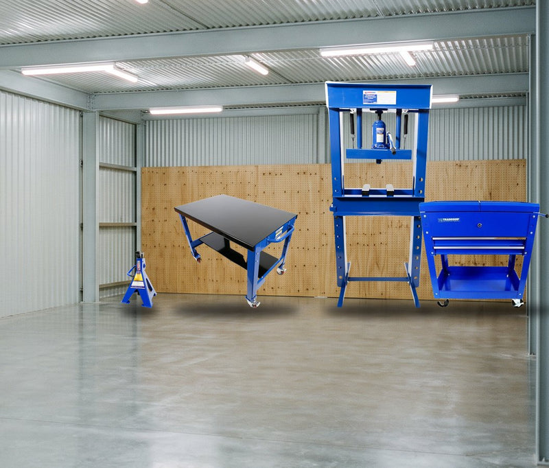 Workshop fitted out with a hydraulic press, workbench and tool trolley
