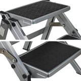 Two views of a metallic step stool with black textured platform on a white background
