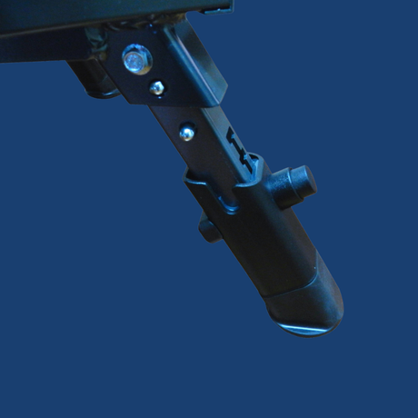 Close-up of a black metal component with a brand logo on a blue background