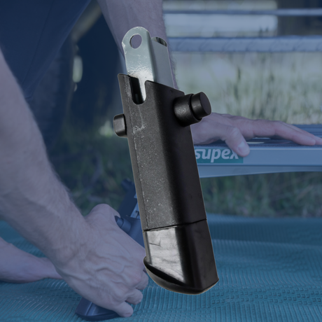 Close-up of a mechanical component being held by a person with a blurred background