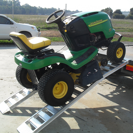 mower on the ramp on the truck rear