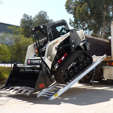 backhoe descending on the ramp