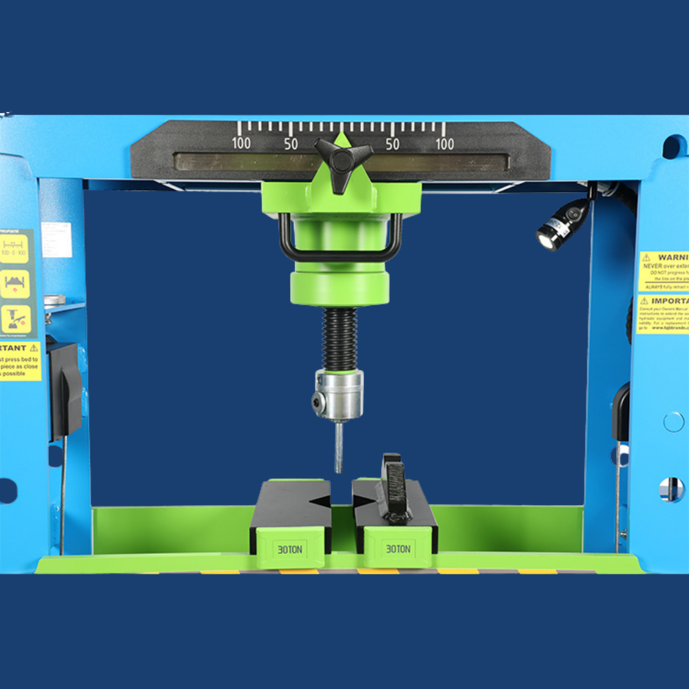 Drilling machine with green and blue casing on a blue background