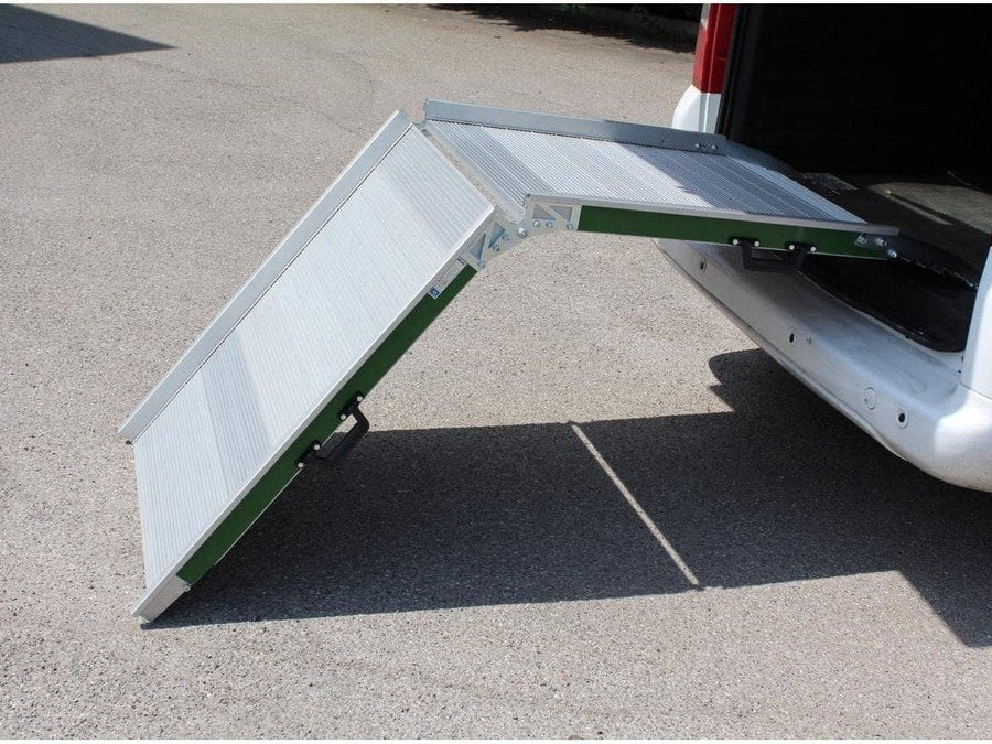 Folding aluminium van ramp resting on the floor at the back of a van