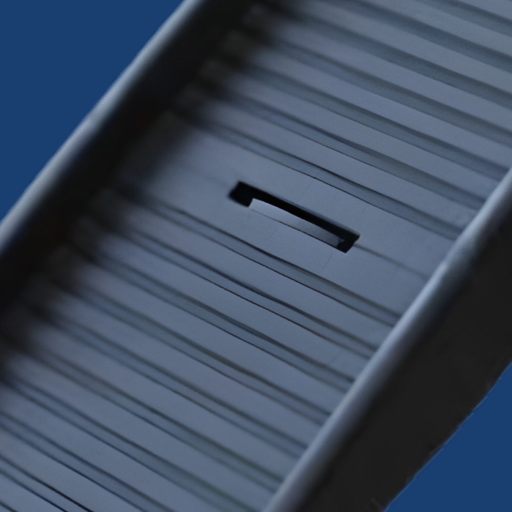 Close-up of a textured surface with horizontal lines against a blue background