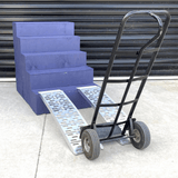 Hand trolley on blue steps using a pair of aluminium curved ramps.