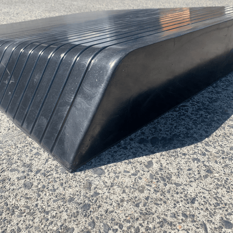 black rubber ramp on a concrete surface